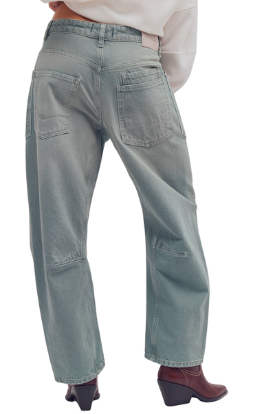 Light blue jeans worn by a person on a white background