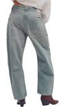 Light blue jeans worn by a person on a white background