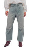 Person wearing light gray cargo pants on a white background