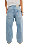 Light blue jeans worn by a person on a white background