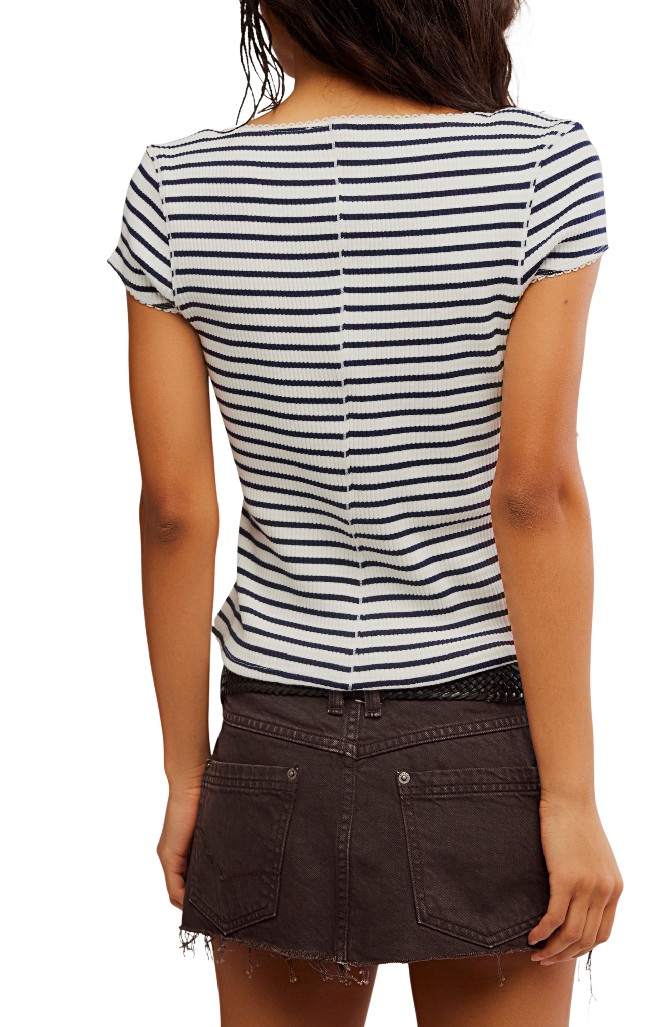 Person wearing a black and white striped shirt with a brown skirt on a white background