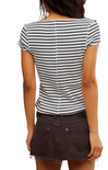 Person wearing a black and white striped shirt with a brown skirt on a white background