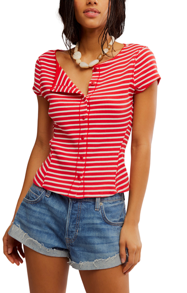Woman wearing a red and white striped shirt with denim shorts on a white background