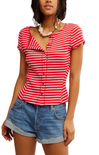 Woman wearing a red and white striped shirt with denim shorts on a white background