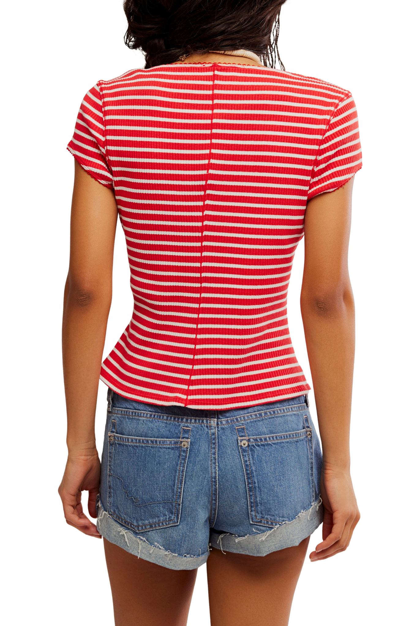 Person wearing a red and white striped shirt and denim shorts on a white background