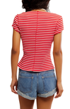 Person wearing a red and white striped shirt and denim shorts on a white background