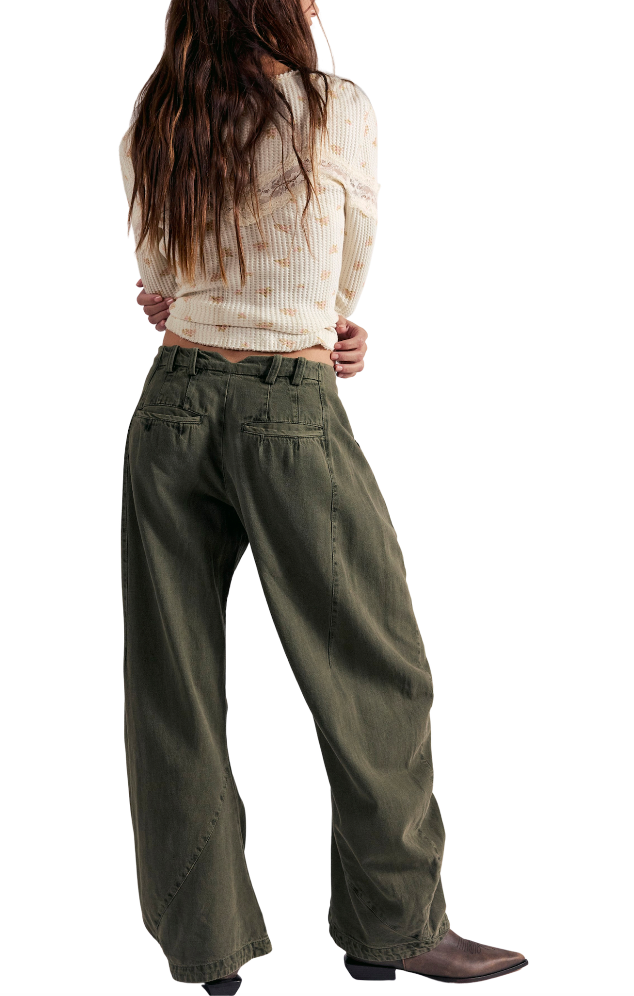 Person wearing olive green wide-leg pants on a white background