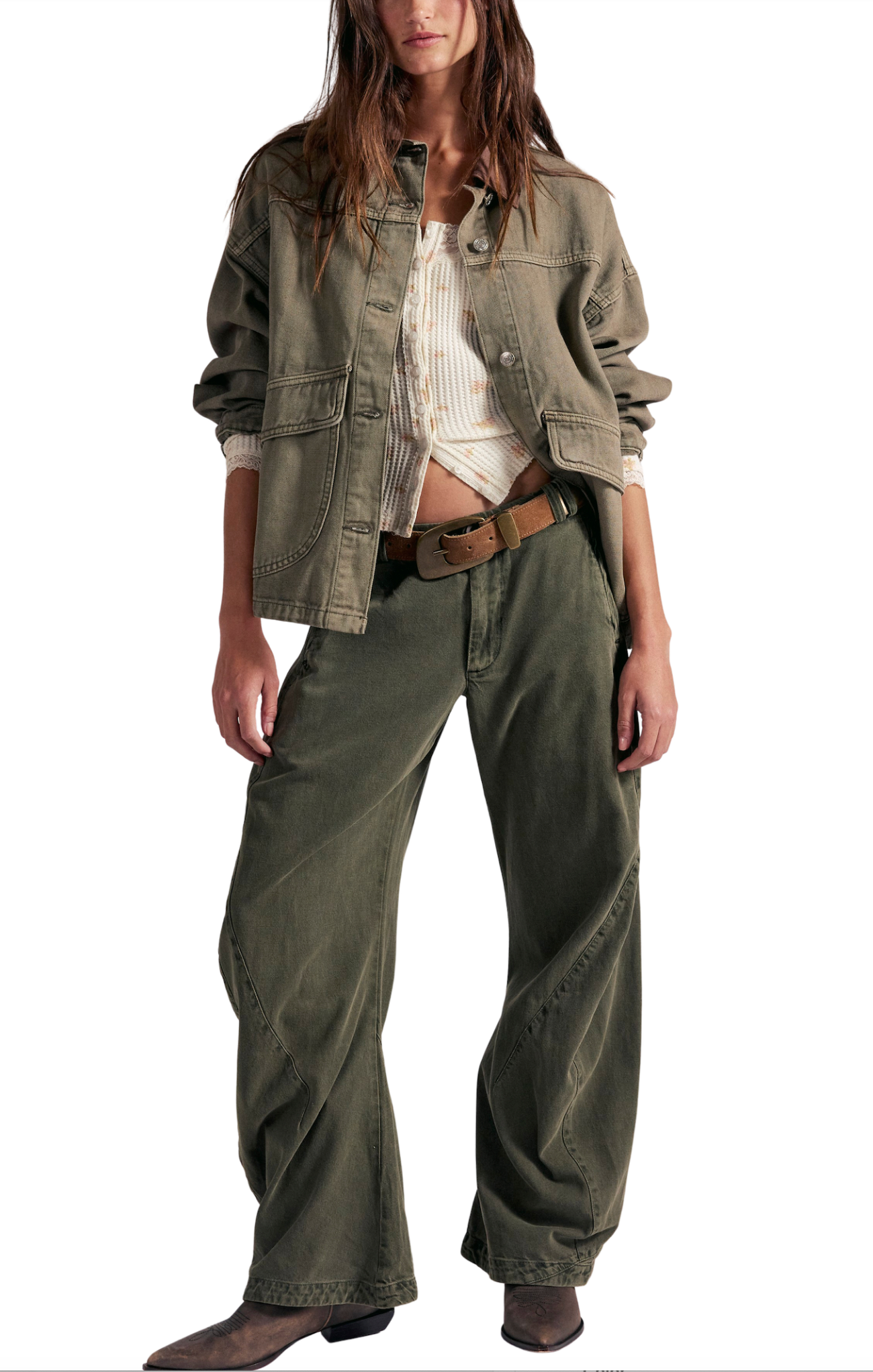 Person wearing a green jacket and wide-leg pants on a white background