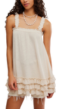 Woman wearing a white lace dress with ruffles on a white background