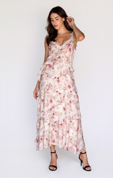 Woman wearing a floral dress against a white background