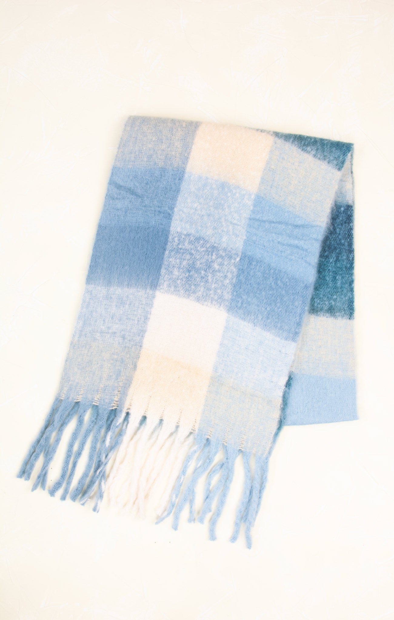Plaid scarf with blue and beige colors on a white background