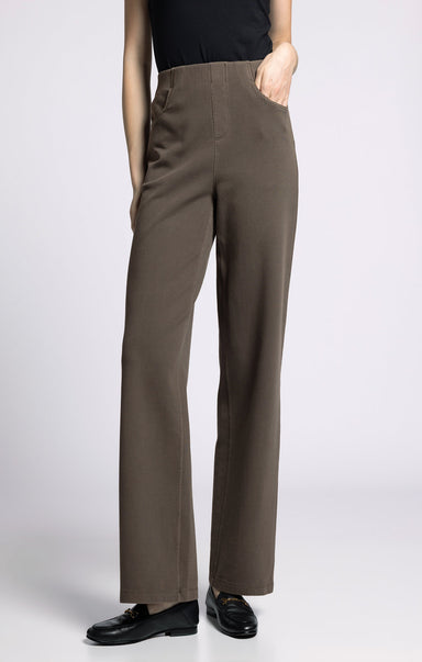 Brown pants worn by a person on a white background