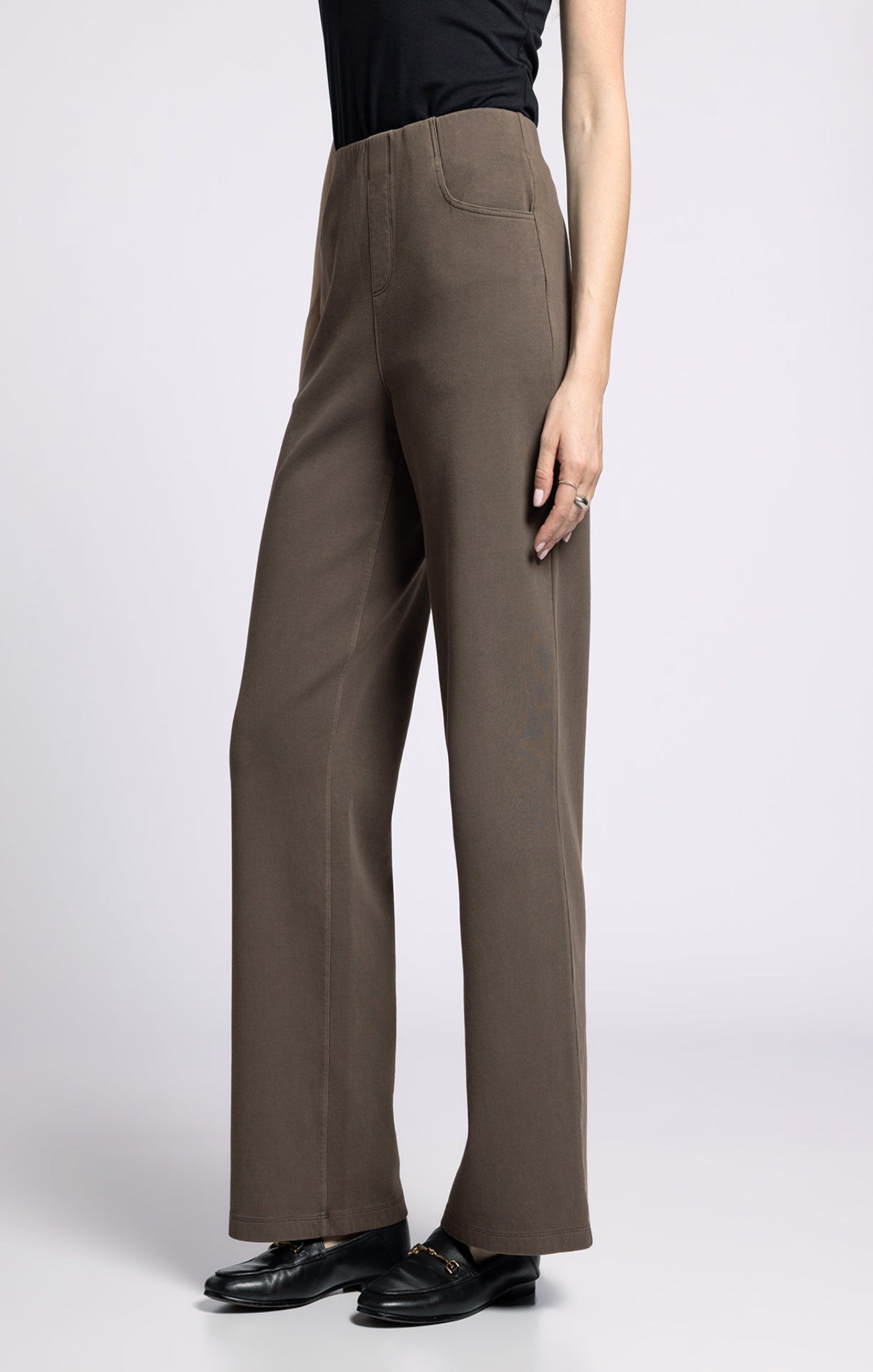 Brown wide-leg pants worn by a person on a white background