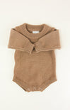 Brown knitted romper with collar on a white background