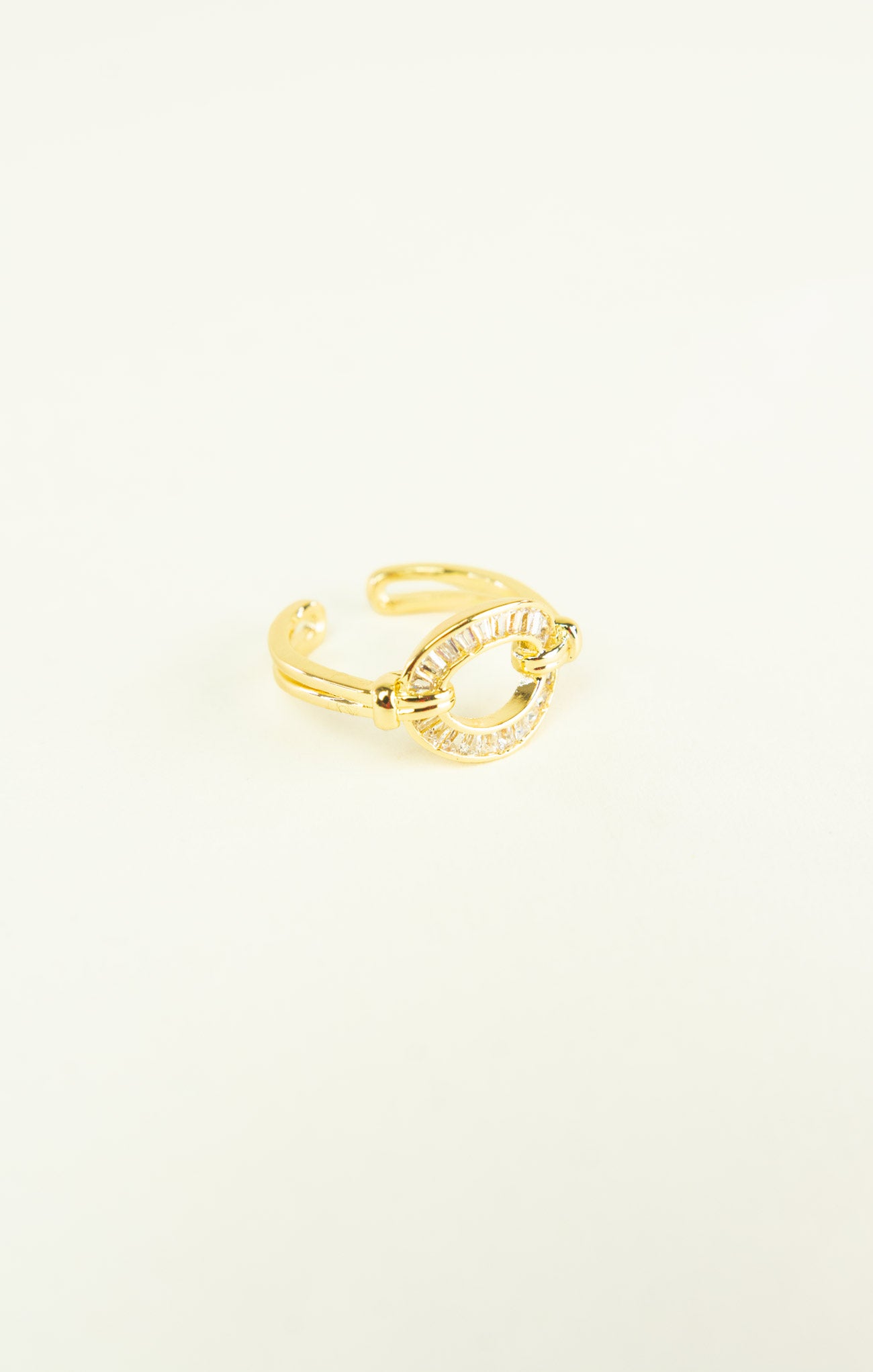 Gold open ring on a white background