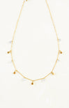 Gold necklace with small pendants on a white background