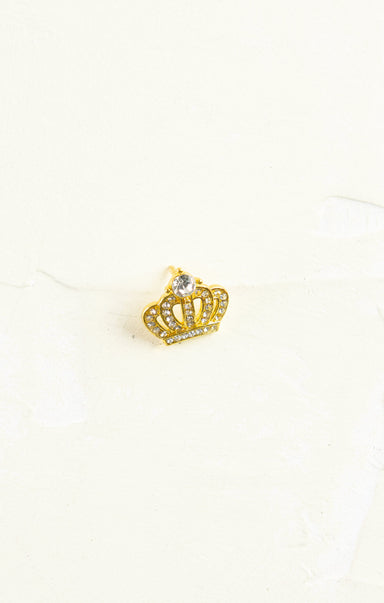 Gold crown-shaped earring on a white background