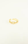 Gold ring on a light beige background