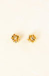 Gold stud earrings with clear gemstones on a white background