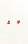 Red boxing glove earrings on a white background