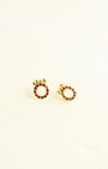 Gold hoop earrings with red and green accents on a white background