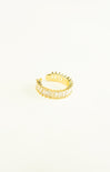 Gold ring with a textured design on a white background