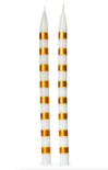 Two white candles with gold stripes on a white background