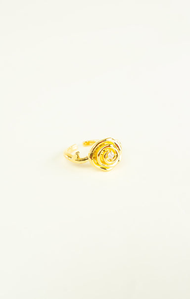 Gold rose-shaped ring on a white background