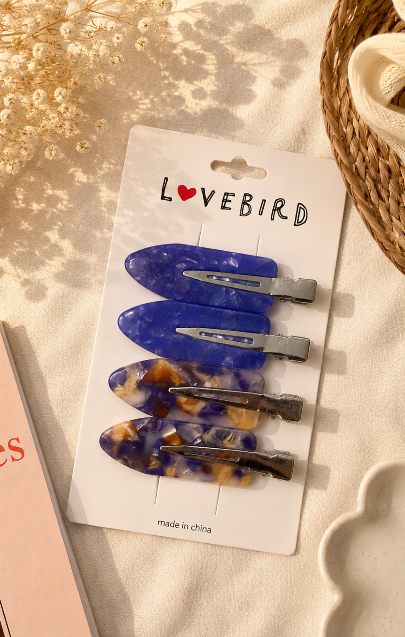 Set of hair clips on a 'Lovebird' branded card with a soft background