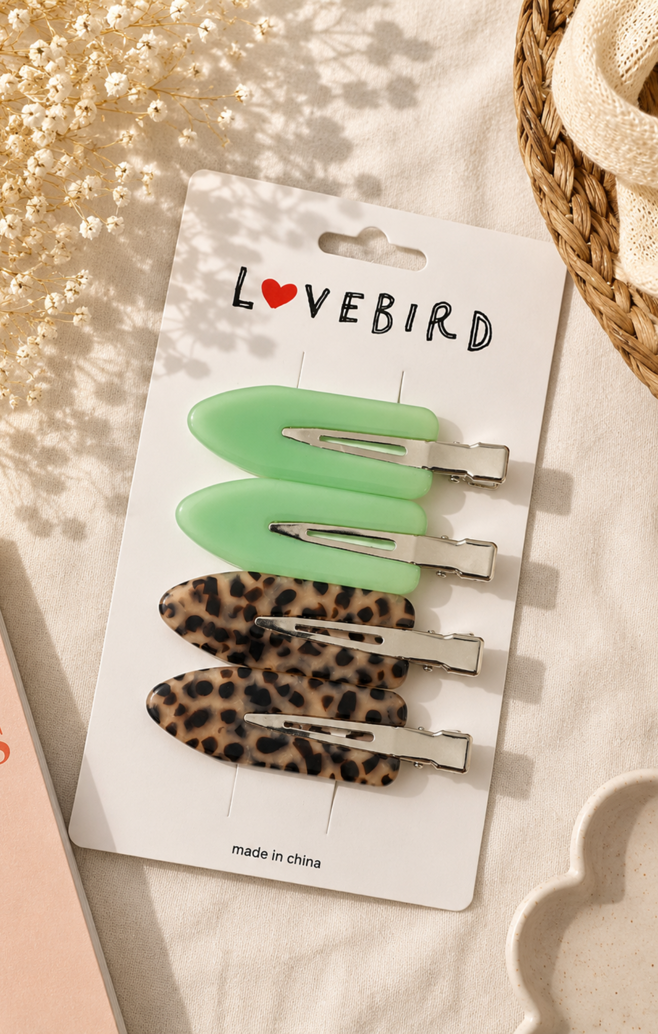 Set of hair clips on a 'LOVEBIRD' branded card with decorative background