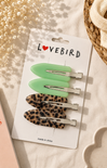 Set of hair clips on a 'LOVEBIRD' branded card with decorative background