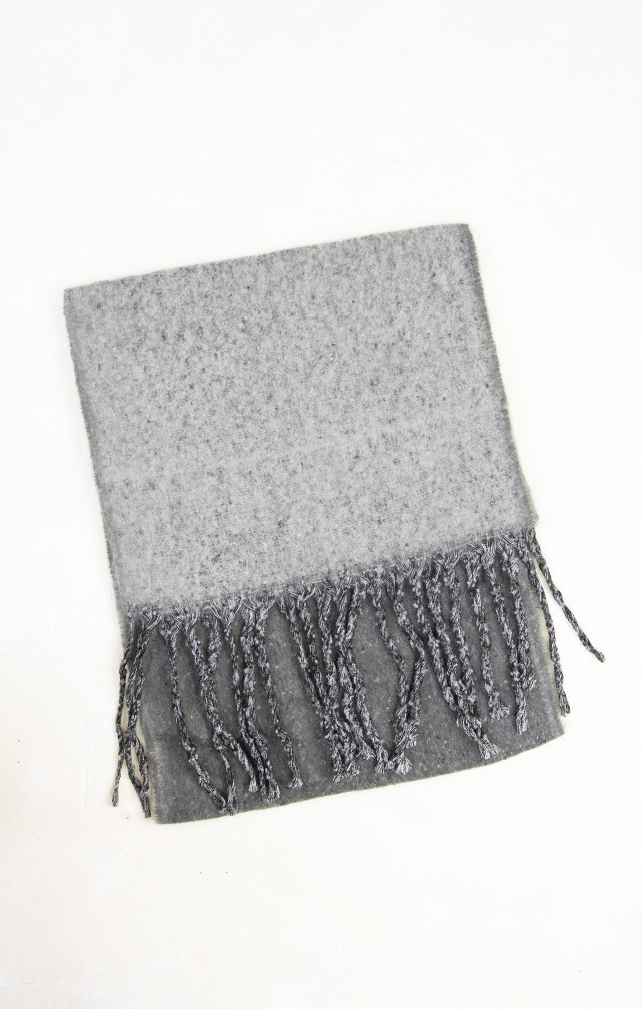 Gray scarf with fringe on a white background