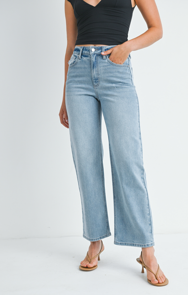 Light blue jeans worn by a person on a white background