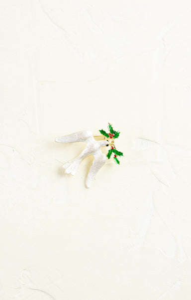 White dove with olive branch on a white background