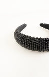 Black beaded headband on a white background