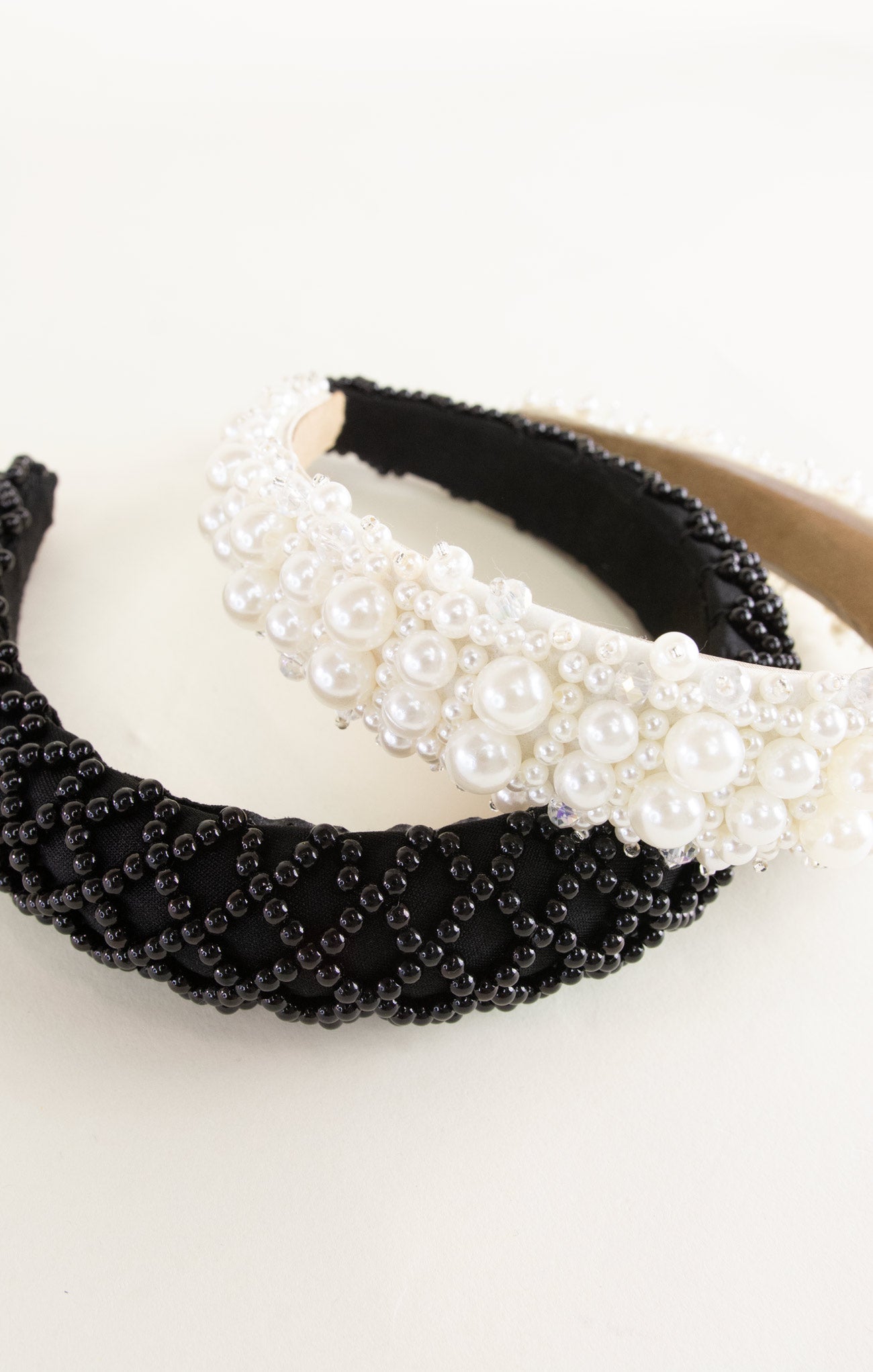 Black and white beaded headband on a white background