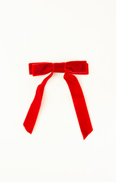 Red velvet bow on a white background