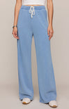 Light blue wide-leg pants with a drawstring waist on a plain background