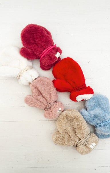 faux fur mittens on white background