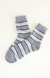 Pair of gray socks with white stripes on a white background