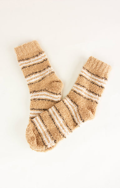 Pair of beige and white striped socks on a white background