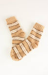 Pair of beige and white striped socks on a white background