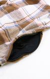 Plaid patterned fabric with a zipper on a white background