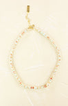 Necklace with small beads on a beige background