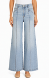 Light blue wide-leg jeans worn by a person on a white background