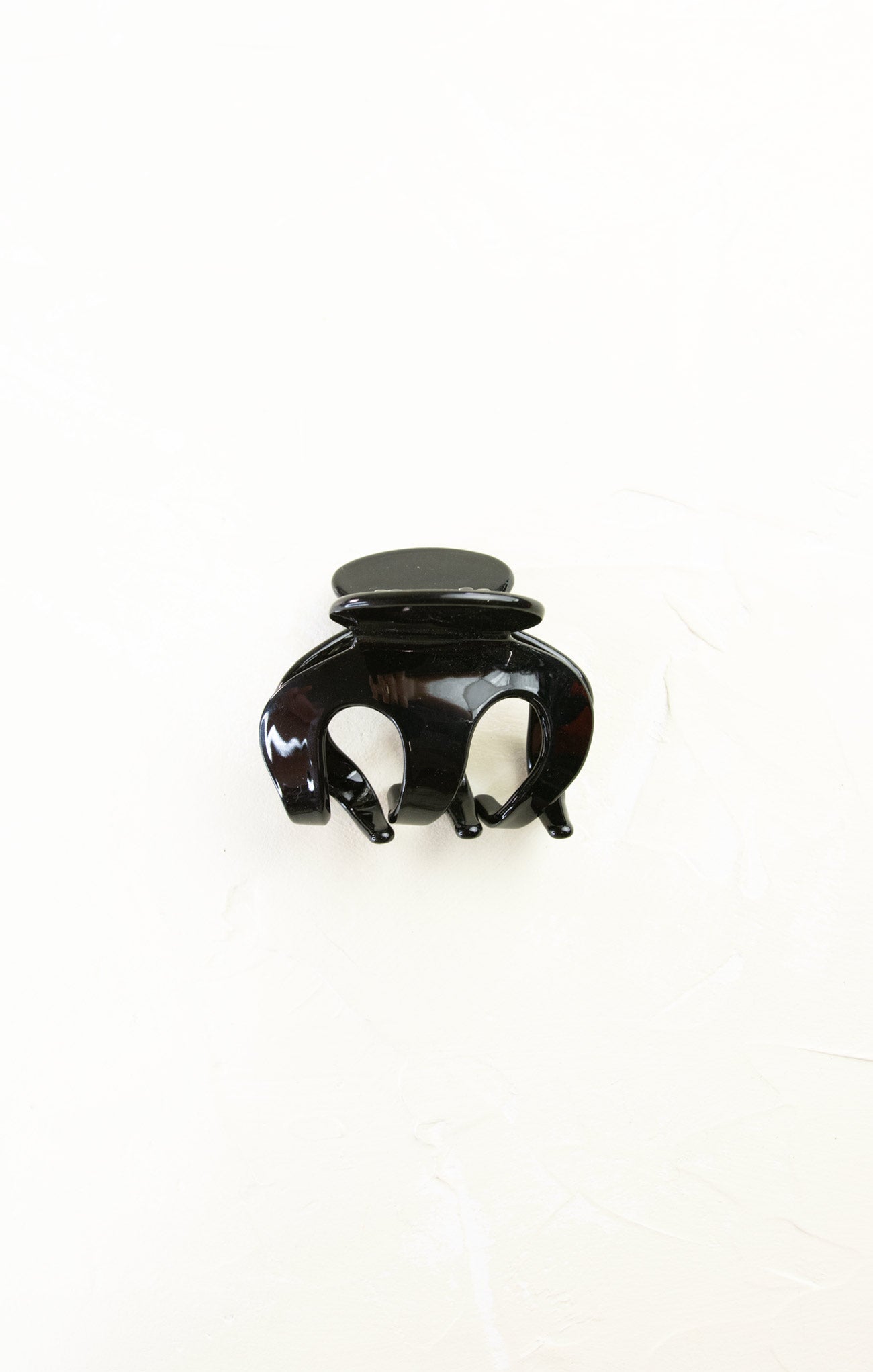 Black hair clip on a white background