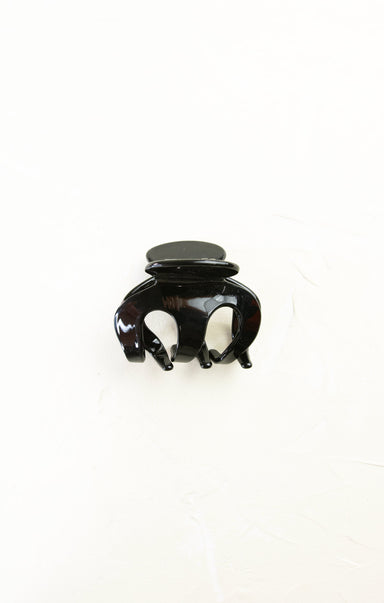 Black hair clip on a white background