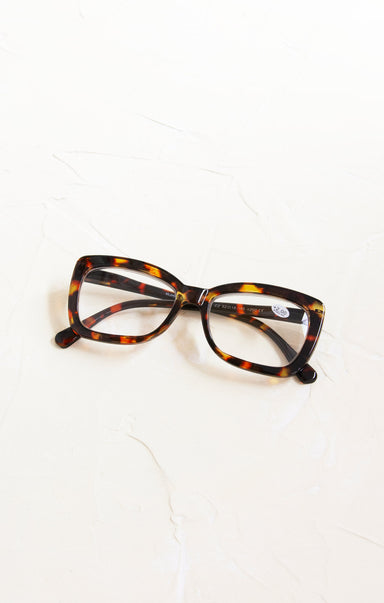 Tortoiseshell cat-eye glasses on a white background
