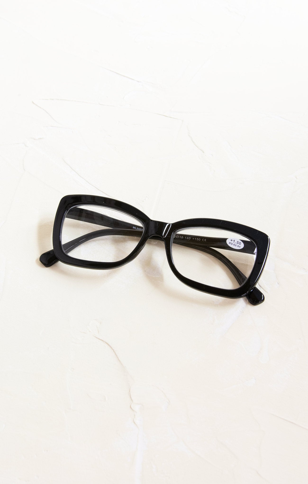 Black cat-eye glasses on a white background