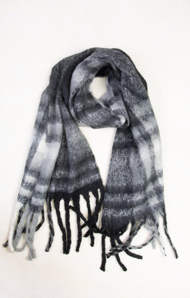 Plaid scarf with black and white pattern on a white background